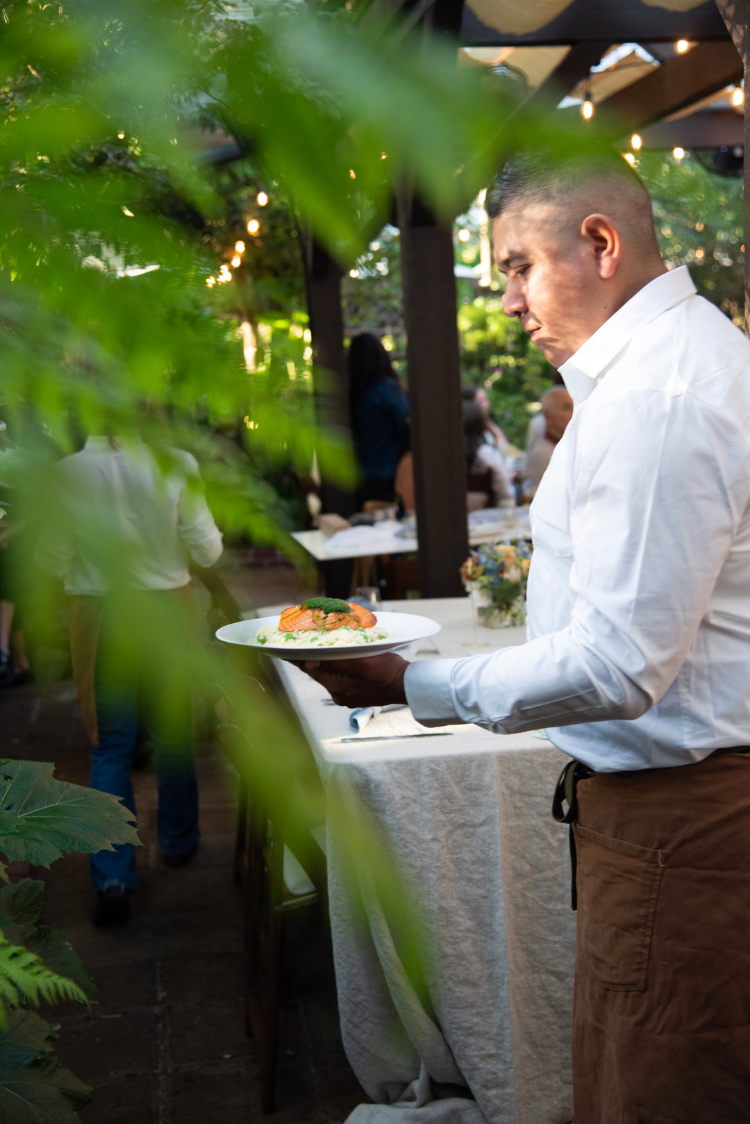 Server carrying a plate of food