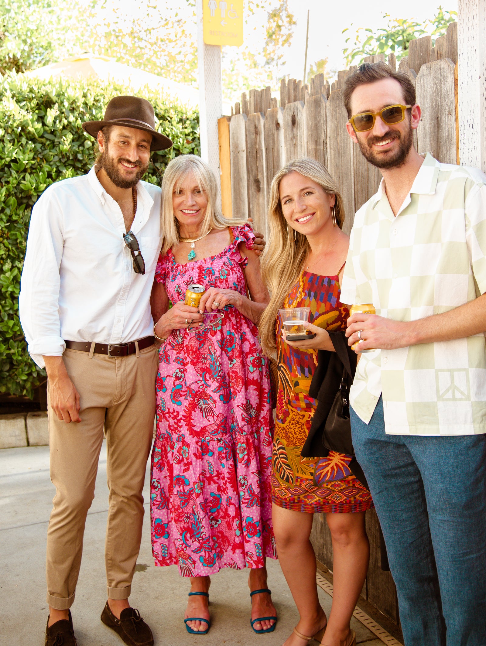 Four people smiling