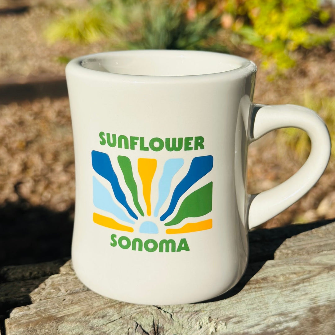 Relive the classic diner experience with the "Rainbow Sun" mug. Its heavyweight design and thick walls keep drinks hot for hours while the vibrant rainbow design adds a pop of color to your collection.  For best care, it is recommended to hand wash this 10 oz ceramic cup. It is also safe to use in the microwave.