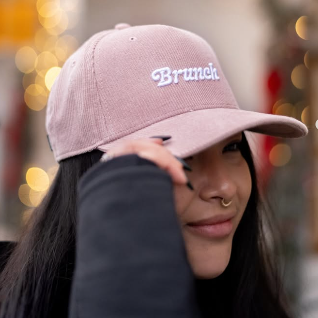 A soft corduroy cap embroidered with Brunch — because brunch isn’t just a meal, it’s a lifestyle.

This soft blush corduroy hat is our love letter to slow mornings, shared tables, and lingering brunch dates.

Featuring embroidered Brunch on the front and Sunflower Caffé stitched on the back, it’s an easy, everyday cap that feels just as good at the café as it does on a morning walk or farmers market run.

Relaxed fit with an adjustable snapback for comfort and ease.