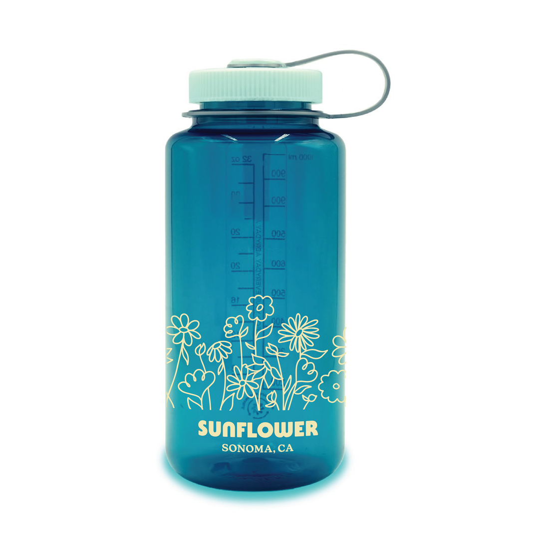 Blue water bottle with floral design and 'Sunflower Sonoma, CA' text on a white background