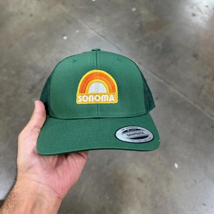 Bold and Bright Trucker Caps for Anyone: These plain 6-panel Flexfit caps sport a mid-profile structure with mesh side and back panels for breathability and an elastic band for all sizes in a cool Evergreen shade Unisex Caps with Sun Shield: These versatile snapback caps for anyone come with a sturdy curved visor and a matching under-brim for added style and protection Premium Craftsmanship: Made of 65% Polyester and 35% Cotton, this trucker hat is durable and perfect for all your team sports needs Cap Care