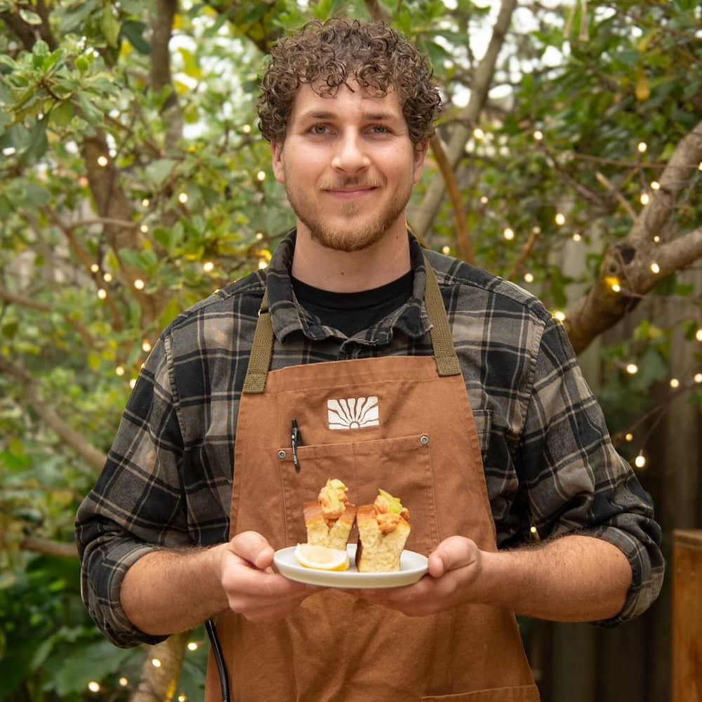 Employee wearing brown sunflower apron