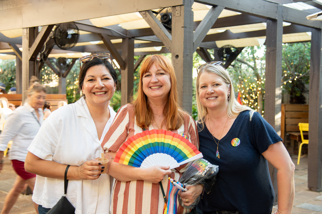 Three women smiling